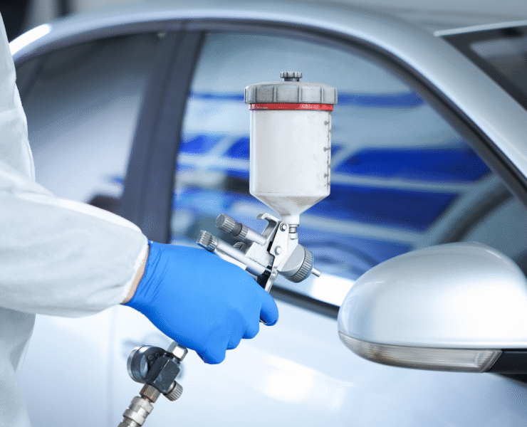 worker-painting-car-in-body-shop-closeup-2025-11-13-23-15-48-utc