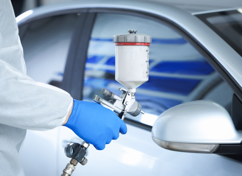 worker-painting-car-in-body-shop-closeup-2025-11-13-23-15-48-utc